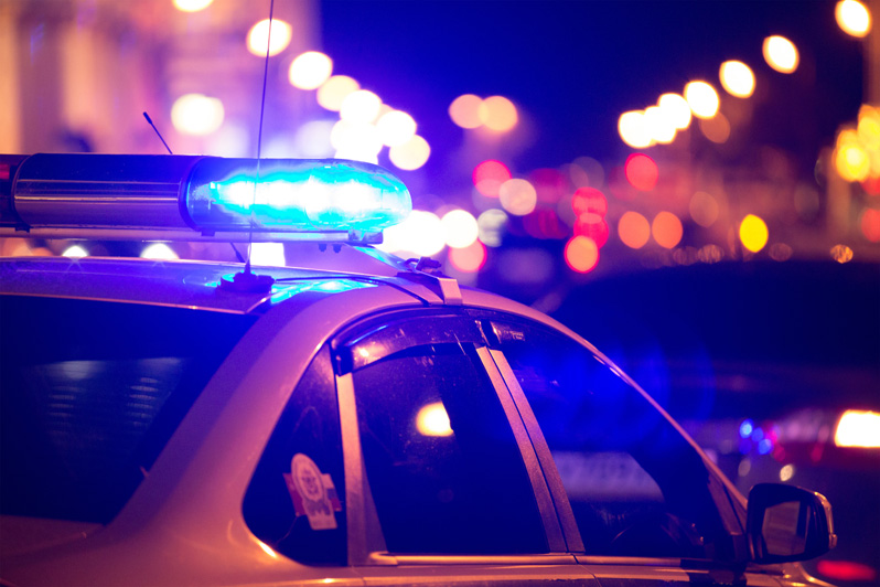 Blue light flasher atop of a police car