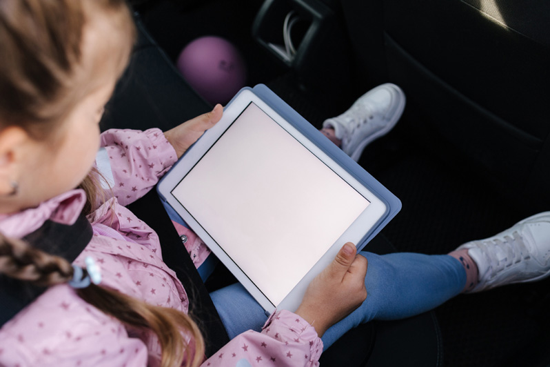 little girl using digital tablet